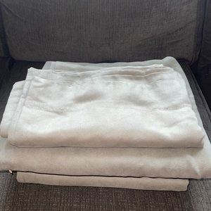 They are like olive green black out curtains. Amazing quality and thick and dark